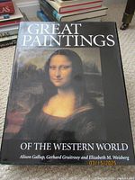 Cover of 'Great Paintings of the Western World' book showing Mona Lisa painting on black background.