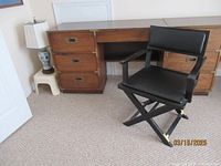 Lane wooden desk with three drawers on each side and brass hardware details, showing overall condition.
