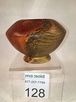 Front view of the beetle pine candle holder showing the wood grain and color variation