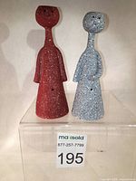 Front view of two CHOUDOUFU abstract whimsical sculpture figurines candle holders/mini planters in red and grey speckled finishes.