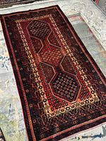 Full view of the rectangular rug laid flat showing overall design and colors