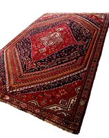 Angled view showing full rug pattern and fringe