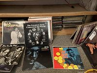 Front view of Ella Fitzgerald, Greatest Jazz Concert and Nat King Cole LPs