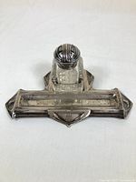 Front view of silver tray and glass inkwell showing overall condition and design