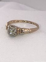 Side profile showing interior inscription and band detail