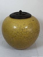 Front view of jar with wooden lid in place