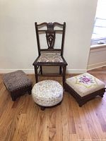 Lot of vintage small furniture including one wooden chair and three needlepoint upholstered stools.