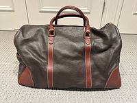 Front view showing full bag, handles and body