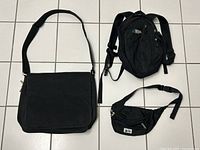 Lot contents showing the three black MEC bags together: backpack, fanny pack, and laptop case