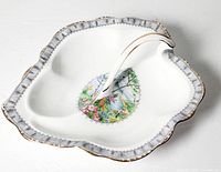 Top angled view of two-part leaf shape relish dish showing scenic Silver Birch pattern and gold trim.