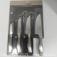 Photo of the Prime Chef 4-piece cutting tool set in packaging showing four knives with black handles and stainless steel blades.