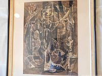 Framed painting under glass at angle showing entire artwork