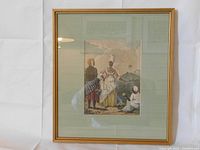 Full view of framed engraving showing three Caribbean figures with a green mat and gold-tone frame.