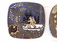 Close-up of 1978 plate showing skier, moose, bird, trees, decorative pattern with stars and swirls.