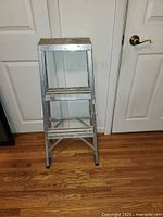 Front view of 3-foot aluminum A-frame ladder with paint marks and rubber feet