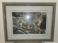 Full front view of framed print showing wolves and frame