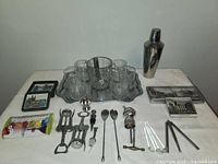 Full view of all barware items arranged on and around the serving tray for display.