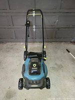 Full front view of Yardworks blue and black electric lawn mower with handle and wheels.