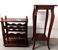 Photo of Bombay wooden wine rack and plant stand side by side, showing front and side views with their dark brown finished wood construction.
