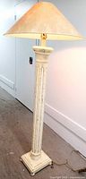 Full view of the floor lamp showing the tall fluted column base in distressed white paint and the large empire shade.