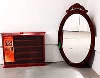 Photo of wall mount wood display case with hinged transparent glass door and multiple shelves for small items, dark wood finish.