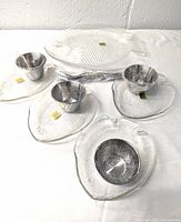 Image showing the full seafood set arrangement including fish platter, four fish plates, and four cocktail cups all textured clear glass.