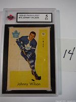 Front of the 1959-60 Parkhurst Johnny Wilson hockey card #13 showing the player in Toronto Maple Leafs uniform with grading label.