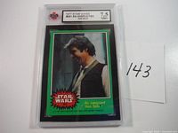 Graded 1977 Topps Star Wars Han Solo card number 251 in protective casing, graded 7.5 NM+. The card image shows Han Solo smiling with a green border.