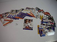 Lot of 1992 Upper Deck Young Guns hockey cards spread out showing front and backs of cards with player images and details.