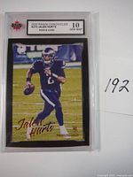 Photo of 2020 Jalen Hurts rookie card from Panini Chronicles #210 with KSA grade 10 in protective slab showing player in Philadelphia Eagles uniform.