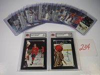 Multiple hockey cards from the 1977 OPC set displayed fanned out, showing condition and quantity.