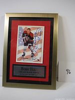 Full view of the framed Bobby Hull autographed hockey card with plaque.