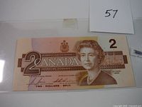 Front of the 1986 Canadian $2 banknote featuring Queen Elizabeth II and security markings.