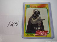 Front of Darth Vader trading card from 1980 Star Wars Series 3 showing image of Darth Vader with Empire Strikes Back branding.