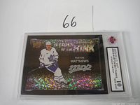 Front view of 2023-24 Upper Deck MVP Stars of the Rink Auston Matthews hockey card with holographic glitter effect in slab graded Gem Mint 10 by PSA.