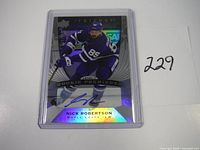 Nick Robertson autographed rookie hockey card featuring blue autograph and holographic background.