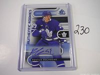 Front view of the autographed Pontus Holmberg hockey rookie card in protective casing showing the player image and signature.