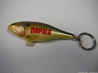 Photo of Rapala Shad-Rap keychain showing fish shape, detailed coloring, and Rapala brand logo.