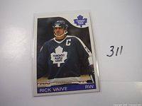 Front side of 1985 Topps Rick Vaive hockey card featuring player in Toronto Maple Leafs uniform with captain insignia.