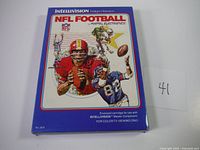 Front cover of NFL Football boxed video game with football players artwork