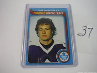 Front view of one Mike Palmateer Toronto Maple Leafs hockey card in protective plastic sleeve, showing the player's portrait and team details.