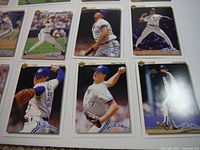 Close-up photo showing nine XL size Toronto Blue Jays baseball cards with various players in pitching and batting action.