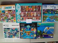 Photo showing all six puzzle boxes with visible themes and piece counts.