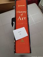 Spine of the book with title and edition details in gold lettering on a red background