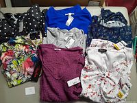 Full view of all tops and swimwear laid out showing colors and patterns