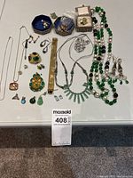 Overview of all jewelry pieces laid out on table