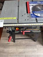 Top view of the Craftsman 10-inch table saw metal work surface showing measurements and additional saw blade in original packaging