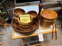 Overview of all items including large salad bowl with smaller bowls stacked inside, salad tongs, pepper mill, and ice bucket.