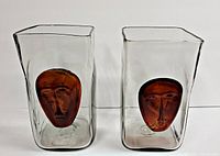 Front view of both vases side by side, showing amber face appliqués.