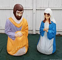 Front view of Mary and Joseph blow mold figures in original paint, showing detailed coloring and kneeling posture